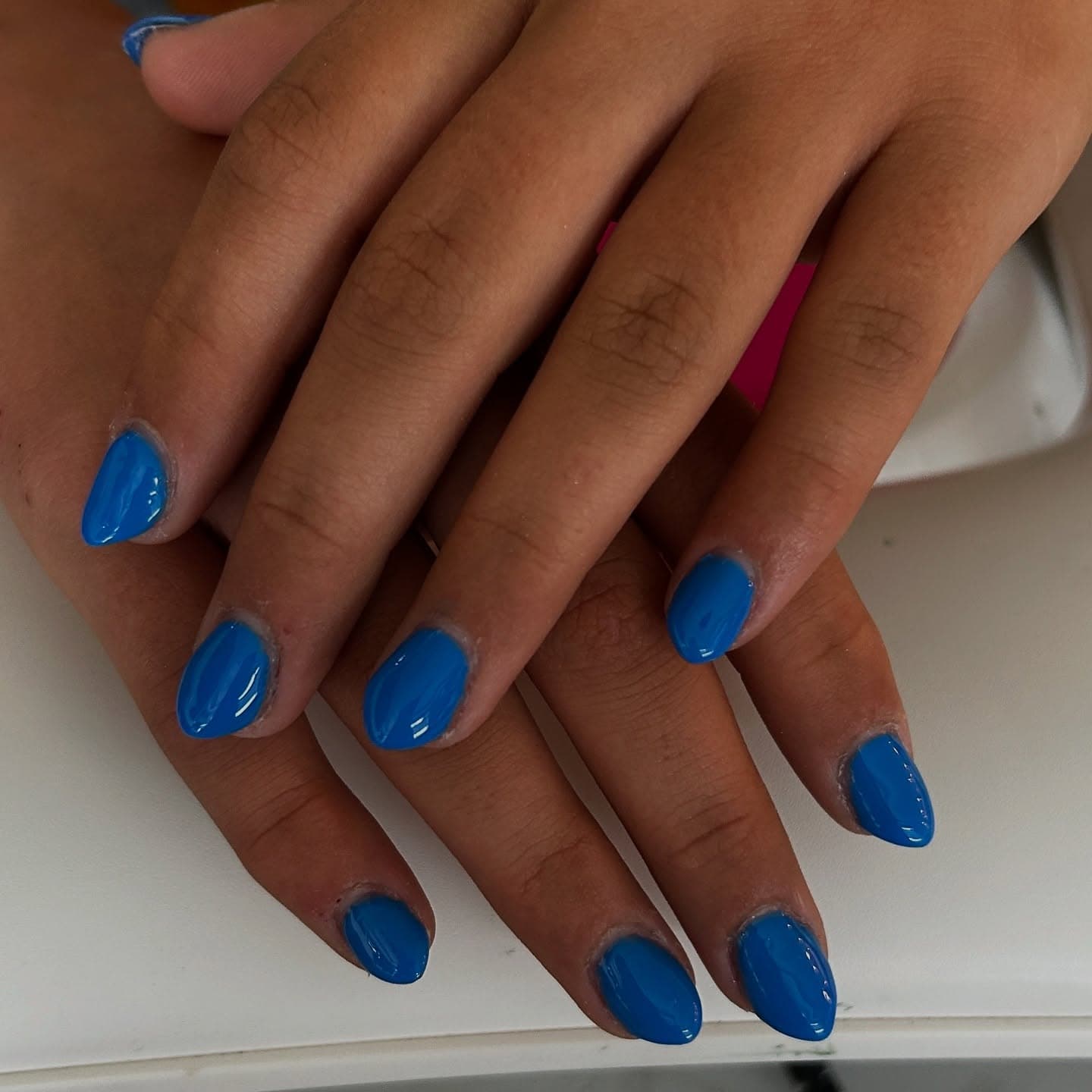 Short round nails in glossy solid cobalt blue